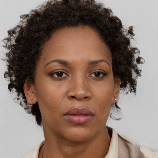 Neutral black adult female with short  brown hair and brown eyes