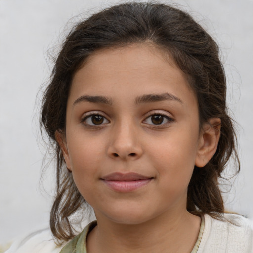 Joyful white child female with medium  brown hair and brown eyes