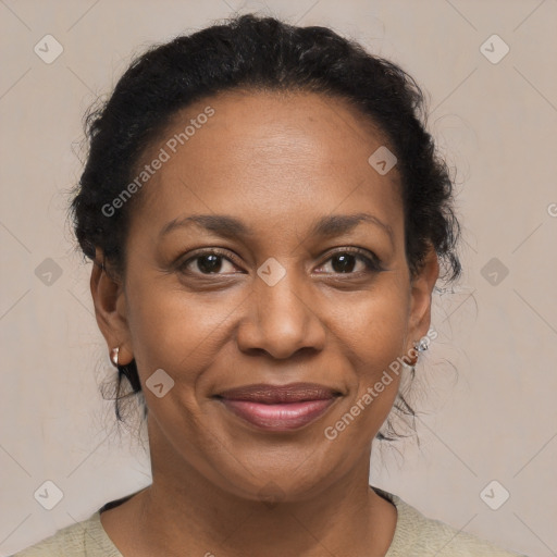 Joyful black adult female with short  brown hair and brown eyes