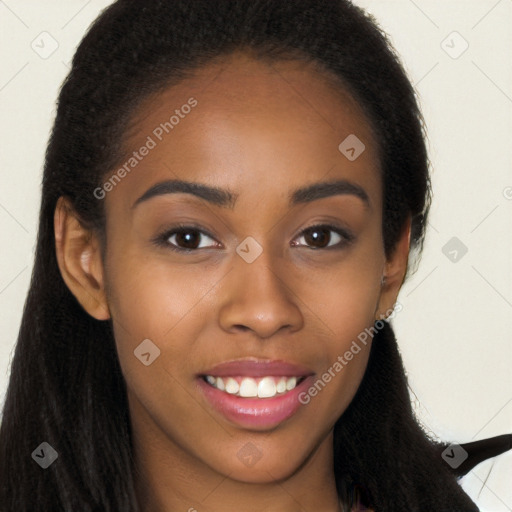 Joyful black young-adult female with long  brown hair and brown eyes