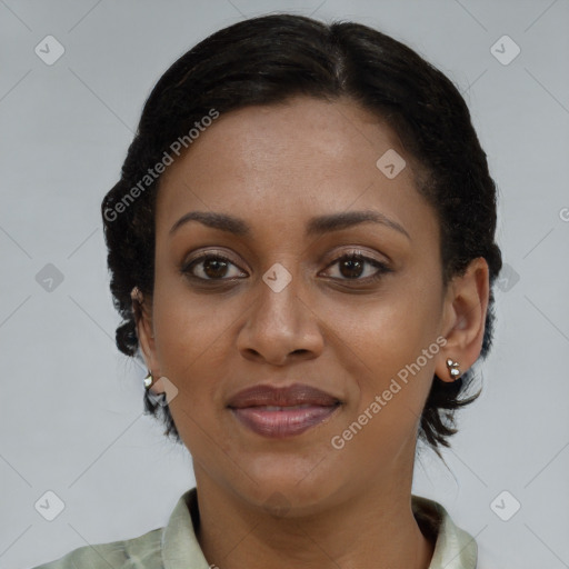 Joyful black young-adult female with short  brown hair and brown eyes