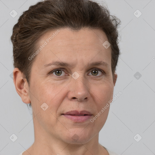 Joyful white adult female with short  brown hair and brown eyes