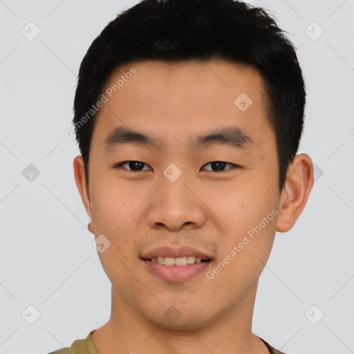 Joyful asian young-adult male with short  black hair and brown eyes