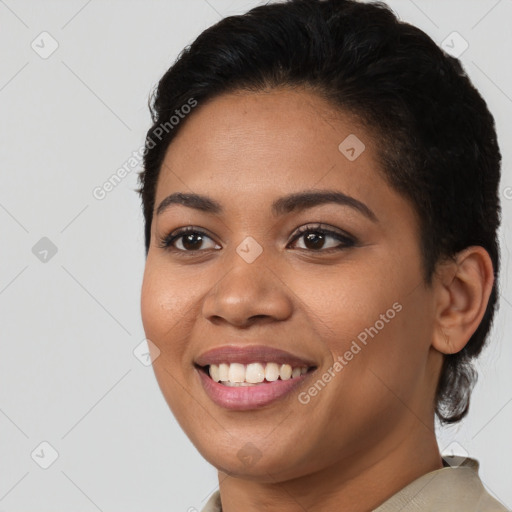 Joyful latino young-adult female with short  black hair and brown eyes