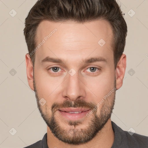 Joyful white adult male with short  brown hair and brown eyes