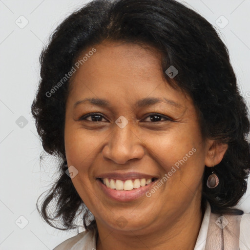 Joyful latino adult female with medium  brown hair and brown eyes