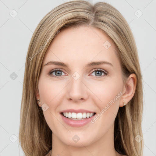 Joyful white young-adult female with long  brown hair and blue eyes