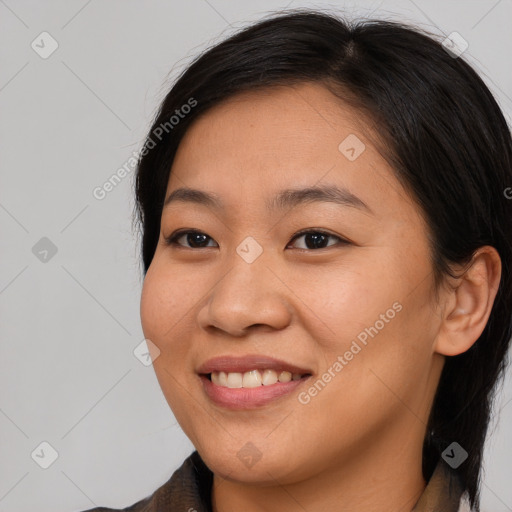 Joyful asian young-adult female with medium  brown hair and brown eyes