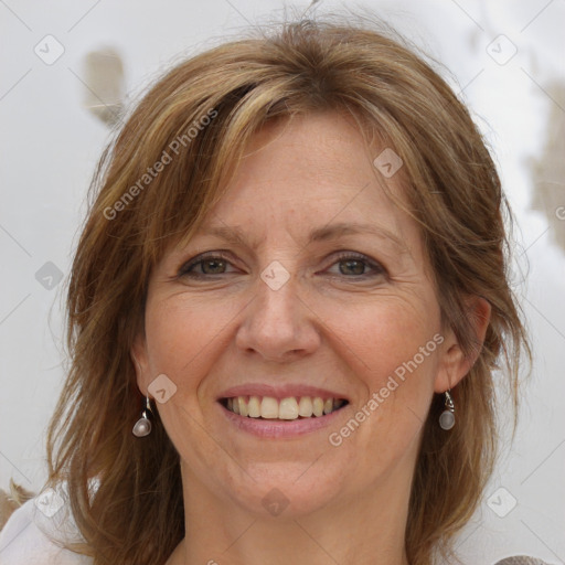 Joyful white adult female with medium  brown hair and grey eyes