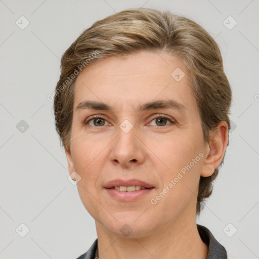 Joyful white adult female with medium  brown hair and grey eyes