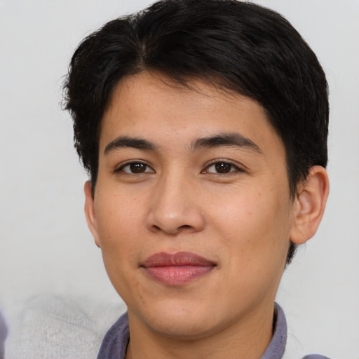 Joyful asian young-adult male with short  brown hair and brown eyes