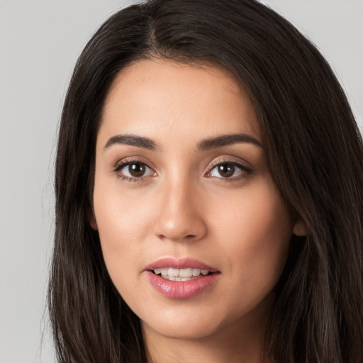 Joyful white young-adult female with long  brown hair and brown eyes