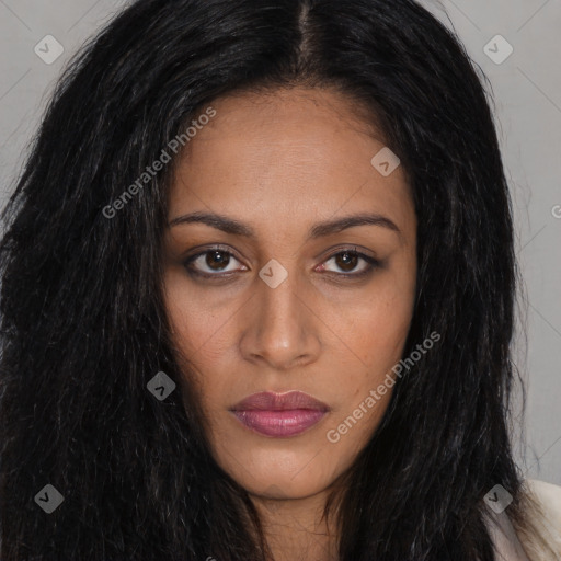 Joyful black young-adult female with long  brown hair and brown eyes