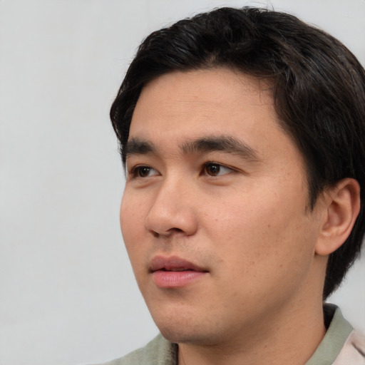 Neutral asian young-adult male with short  black hair and brown eyes