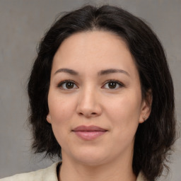 Joyful asian young-adult female with medium  brown hair and brown eyes