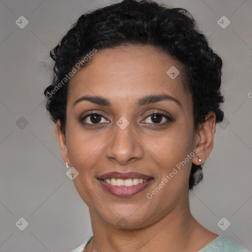 Joyful latino young-adult female with short  black hair and brown eyes