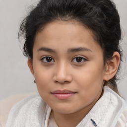 Joyful white child female with short  brown hair and brown eyes