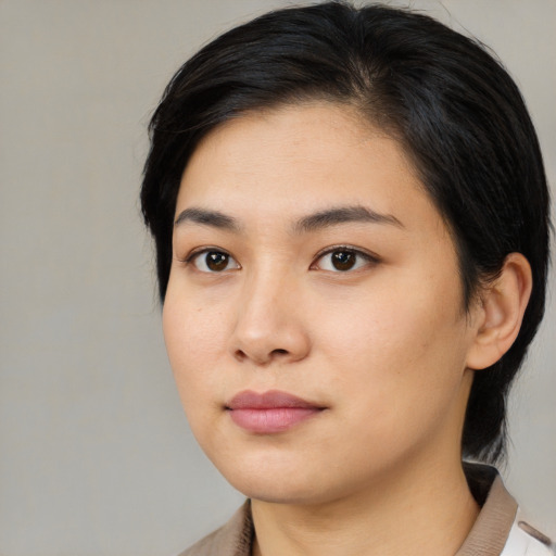 Neutral asian young-adult female with medium  black hair and brown eyes
