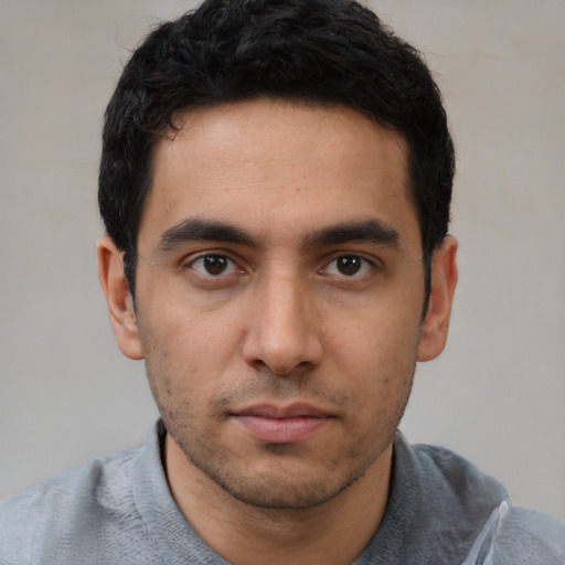 Neutral white young-adult male with short  black hair and brown eyes
