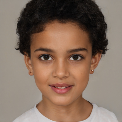 Joyful latino child female with short  brown hair and brown eyes