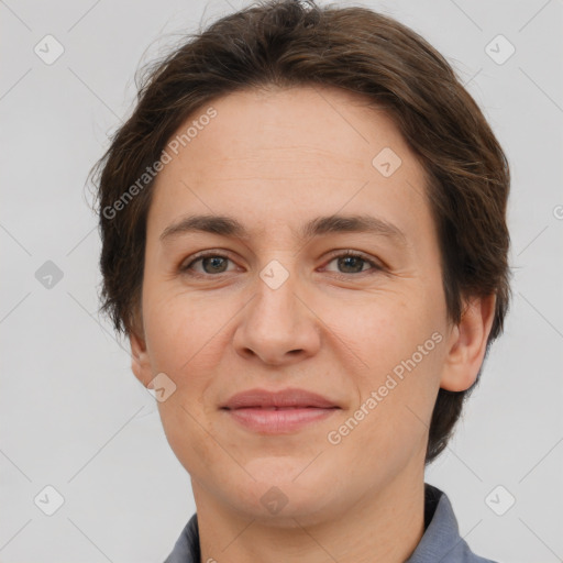 Joyful white adult female with short  brown hair and brown eyes