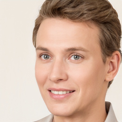 Joyful white young-adult female with short  brown hair and grey eyes