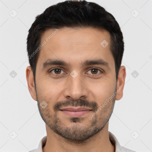 Joyful white young-adult male with short  black hair and brown eyes