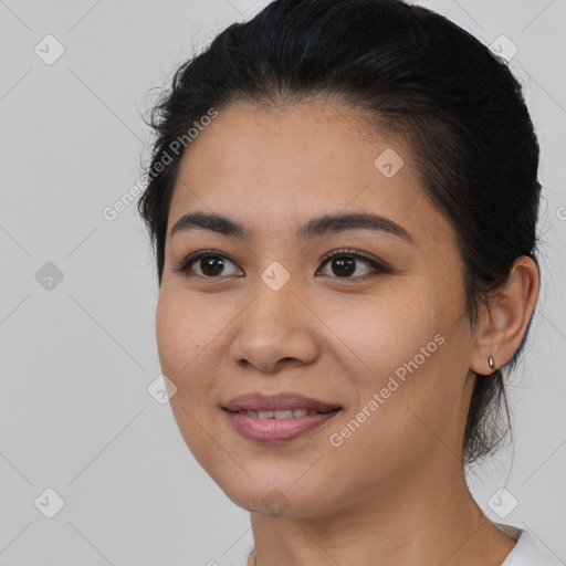 Joyful white young-adult female with medium  black hair and brown eyes