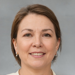 Joyful white adult female with medium  brown hair and brown eyes