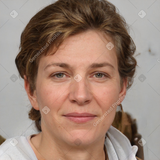 Joyful white adult female with medium  brown hair and blue eyes