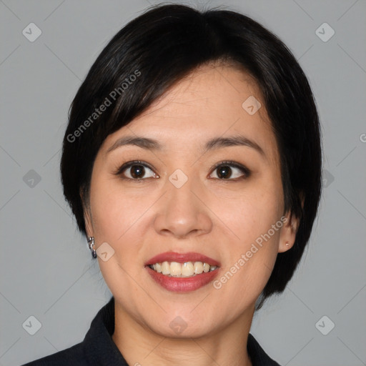 Joyful asian young-adult female with medium  black hair and brown eyes