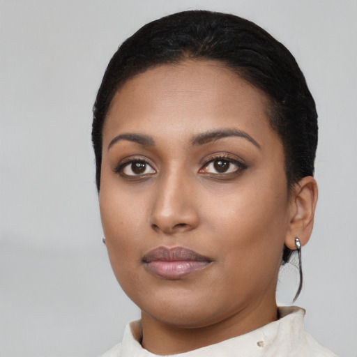 Neutral black young-adult female with short  black hair and brown eyes