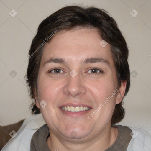 Joyful white adult male with medium  brown hair and brown eyes