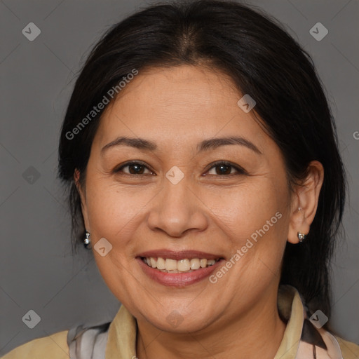 Joyful white adult female with medium  brown hair and brown eyes