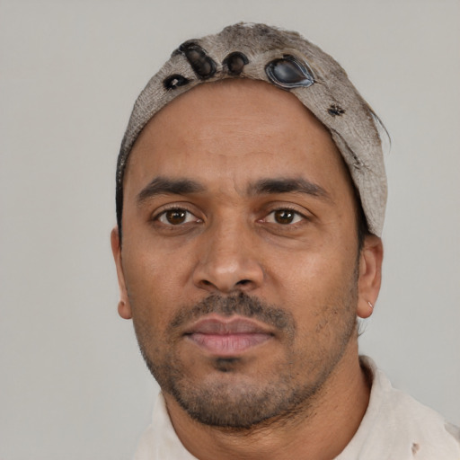 Neutral latino adult male with short  black hair and brown eyes