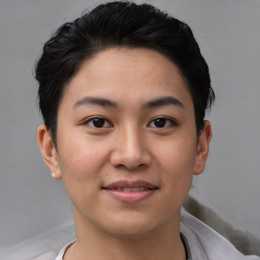Joyful white young-adult female with short  black hair and brown eyes