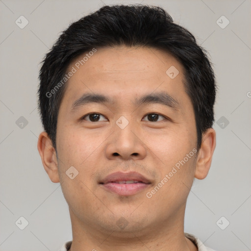 Joyful asian young-adult male with short  brown hair and brown eyes