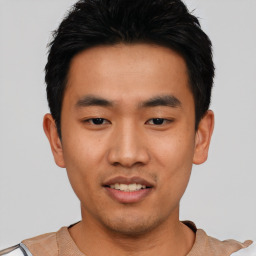 Joyful asian young-adult male with short  black hair and brown eyes