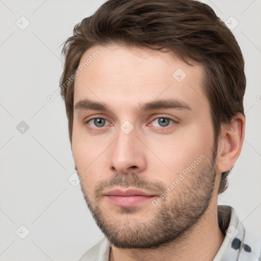 Neutral white young-adult male with short  brown hair and brown eyes