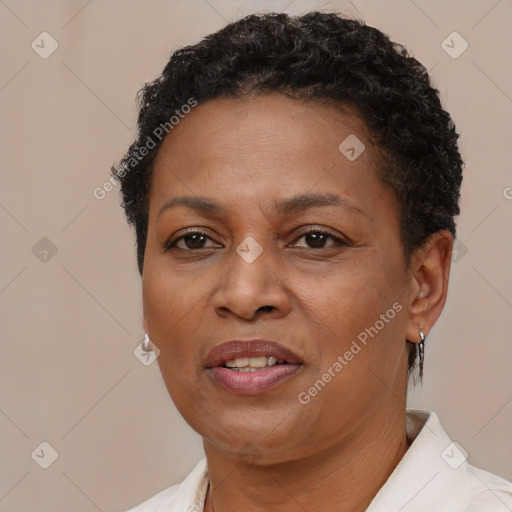 Joyful black adult female with short  brown hair and brown eyes