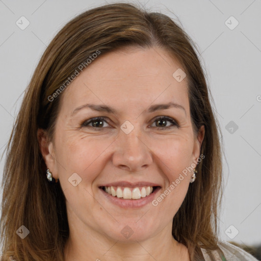 Joyful white adult female with long  brown hair and brown eyes