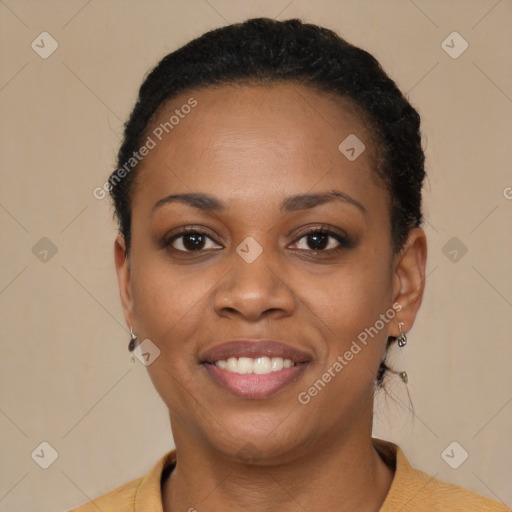 Joyful black young-adult female with short  black hair and brown eyes