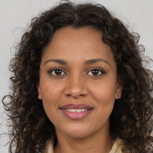 Joyful white young-adult female with long  brown hair and brown eyes