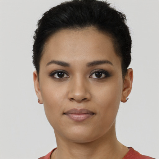 Joyful latino young-adult female with short  brown hair and brown eyes