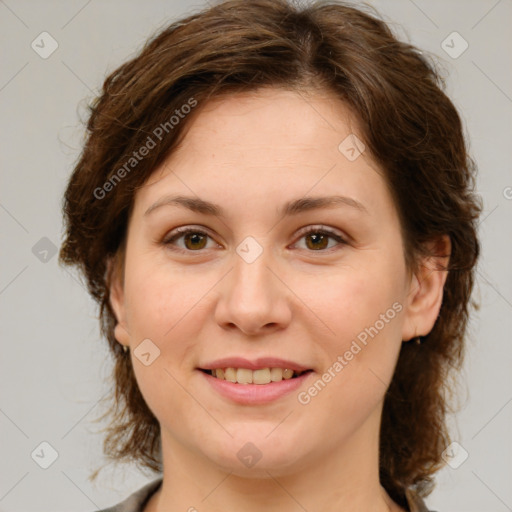 Joyful white young-adult female with medium  brown hair and green eyes