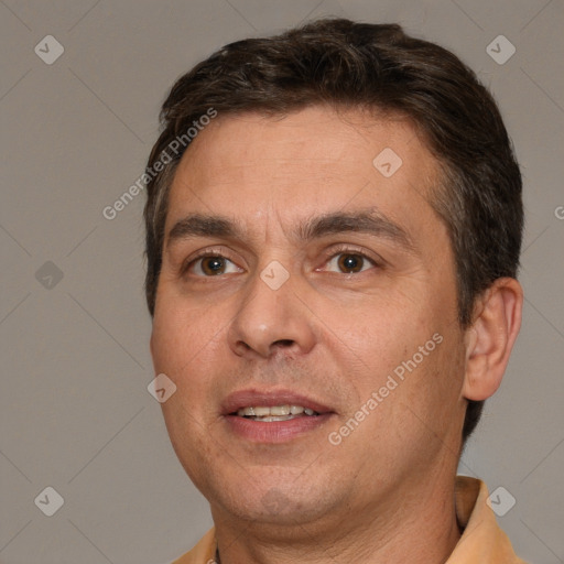 Joyful white adult male with short  brown hair and brown eyes