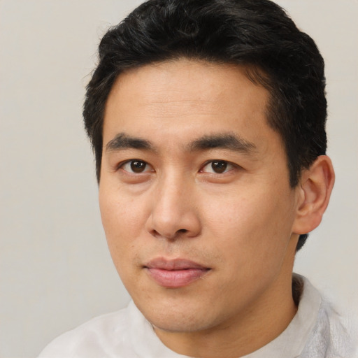 Neutral asian young-adult male with short  brown hair and brown eyes