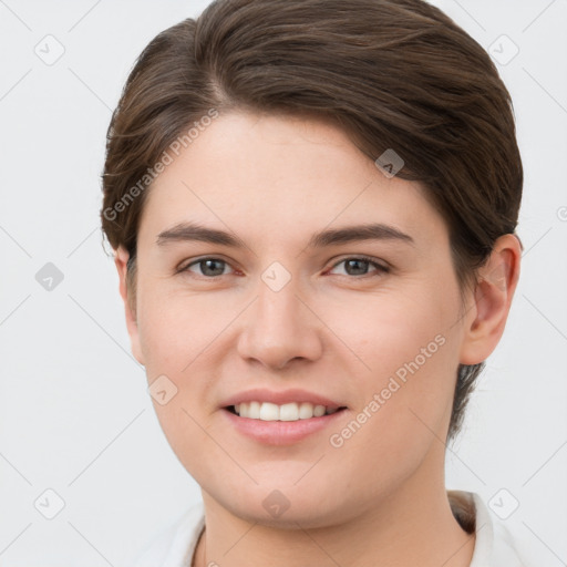 Joyful white young-adult female with short  brown hair and grey eyes