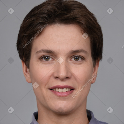 Joyful white young-adult female with short  brown hair and grey eyes