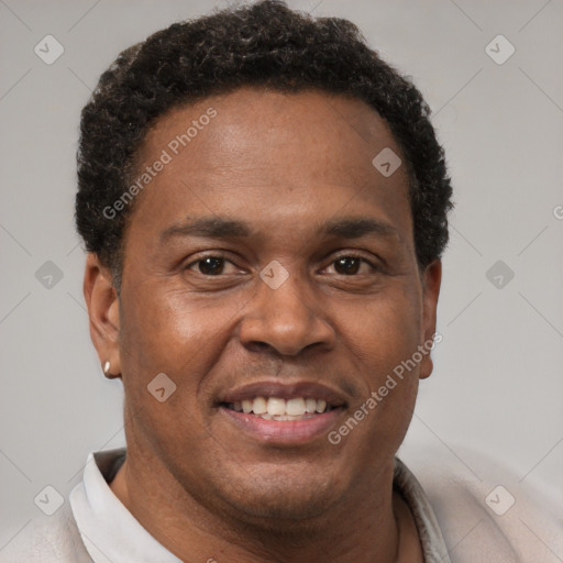 Joyful latino young-adult male with short  brown hair and brown eyes